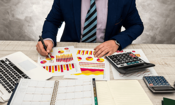 financial-inspector-making-report-financial-planning-report-using-graph-chart-paper-laptop-income-budget-sale-this-year_359031-11240 financial-inspector-making-report-financial-planning-report-using-graph-chart-paper-laptop-income-budget-sale-this-year_359031-11240